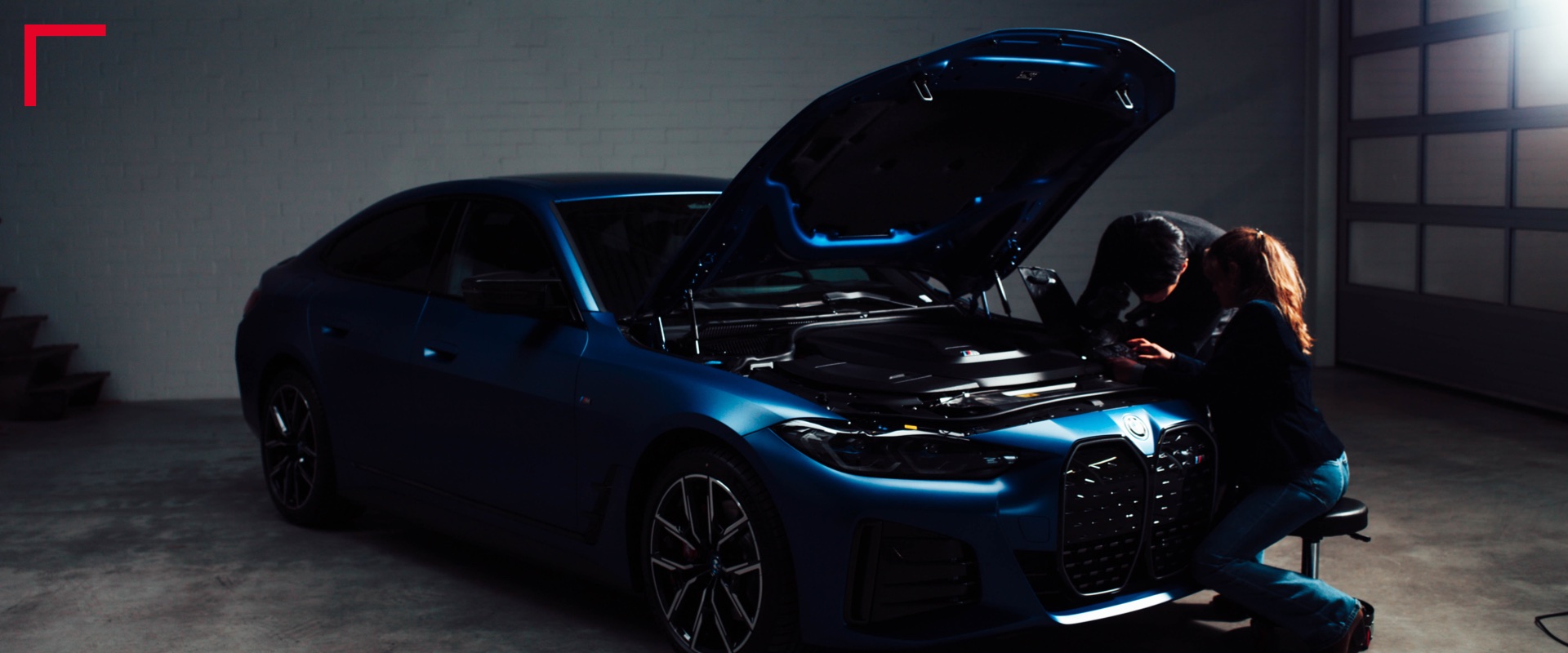 2 people checking the inside of a car Image